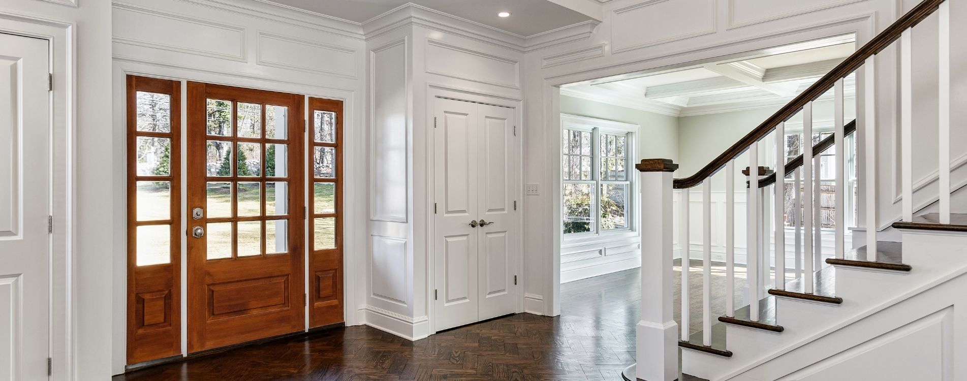 entry foyer of a home staircase hardwood floors